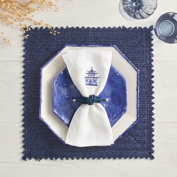 Luxury Rope Knot Napkin Ring in navy with handwoven nautical design styled with navy placemat.