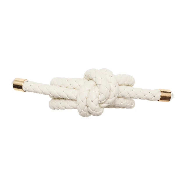 Close-up of braided faux leather napkin ring by Kim Seybert