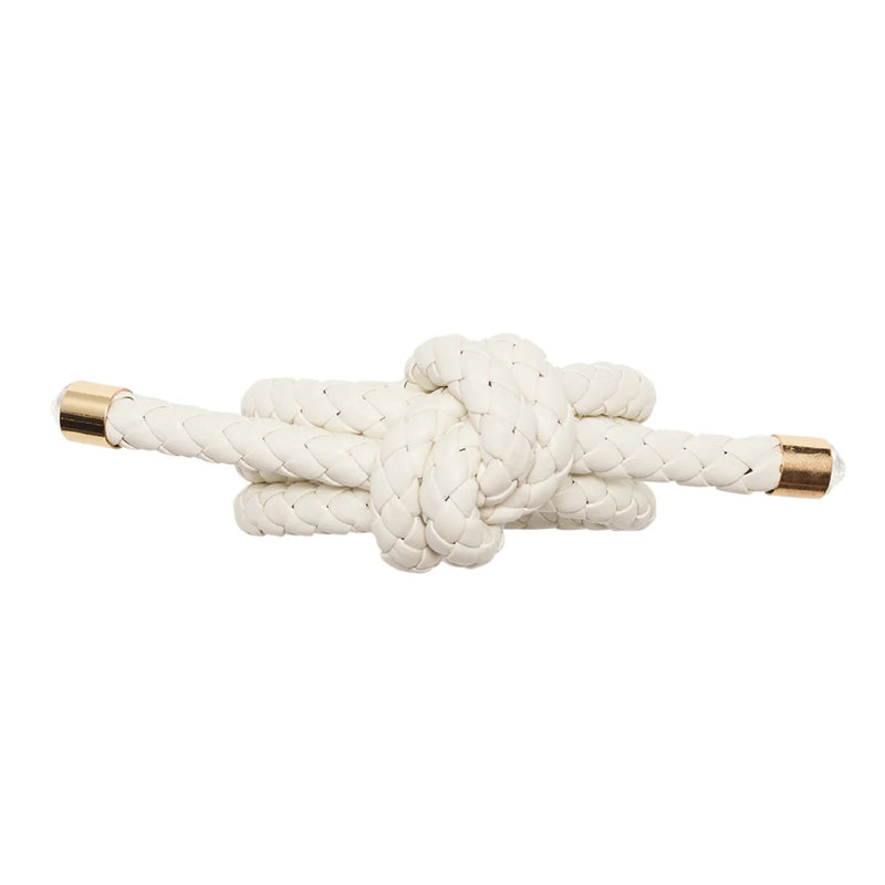 Close-up of braided faux leather napkin ring by Kim Seybert