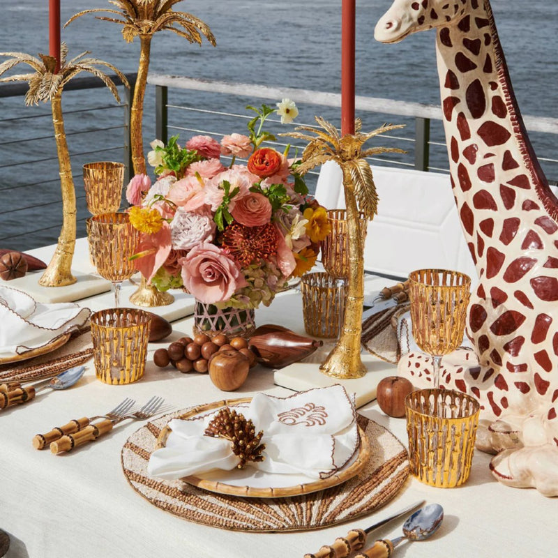 Safari-inspired tablescape featuring Royal Palm Napkin Ring in brown and gold
