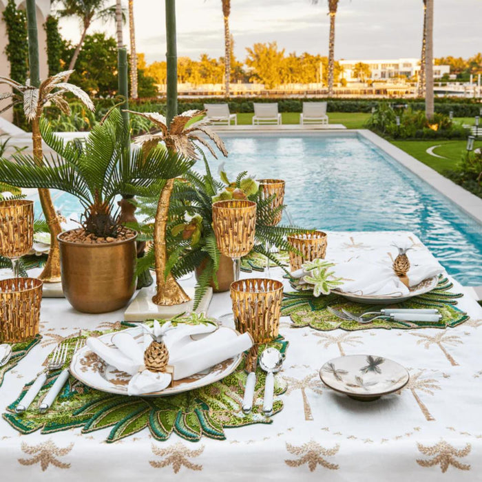Sunny Isles Handcrafted Pineapple Napkin Ring styled on luxury dining table by the pool.