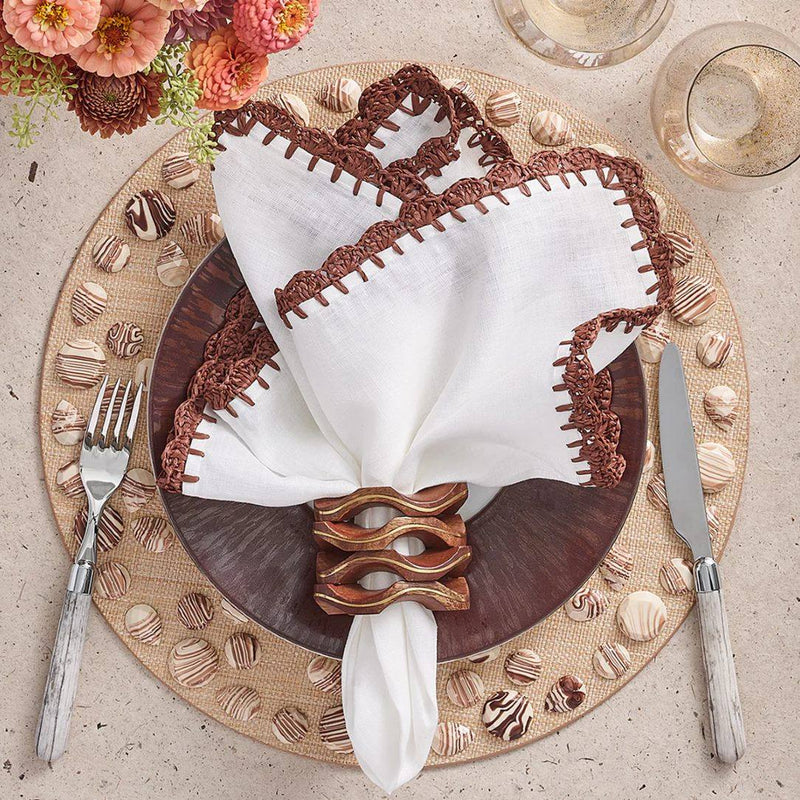 Beige, white, and brown table décor featuring Pavilion Napkin Ring in mango wood
