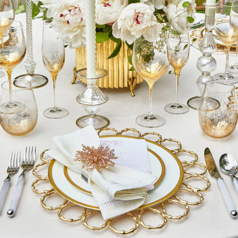 Close-up of Brilliant blush pink napkin ring on white napkin, stylish table accent from Amiramour