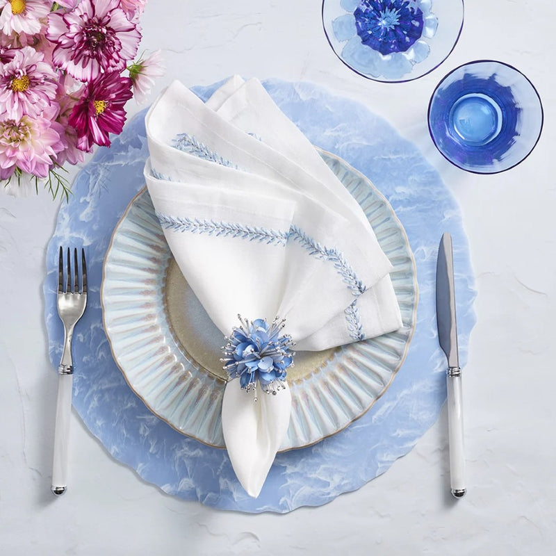 Elegant spring table arrangement in periwinkle and white featuring Starburst Napkin Rings