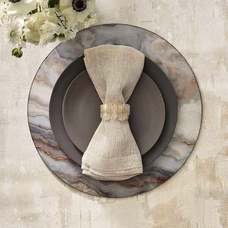 Nude and marble-toned table decor featuring Radiant Napkin Ring by Kim Seybert