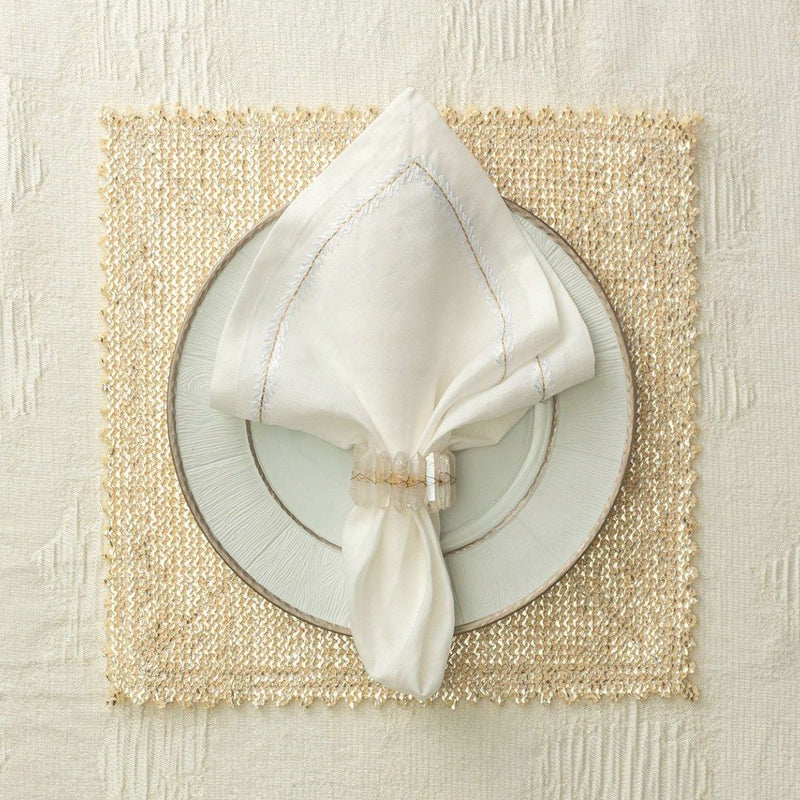 Cream and gold luxury table setting with Radiant Napkin Ring by Kim Seybert at Amiramour