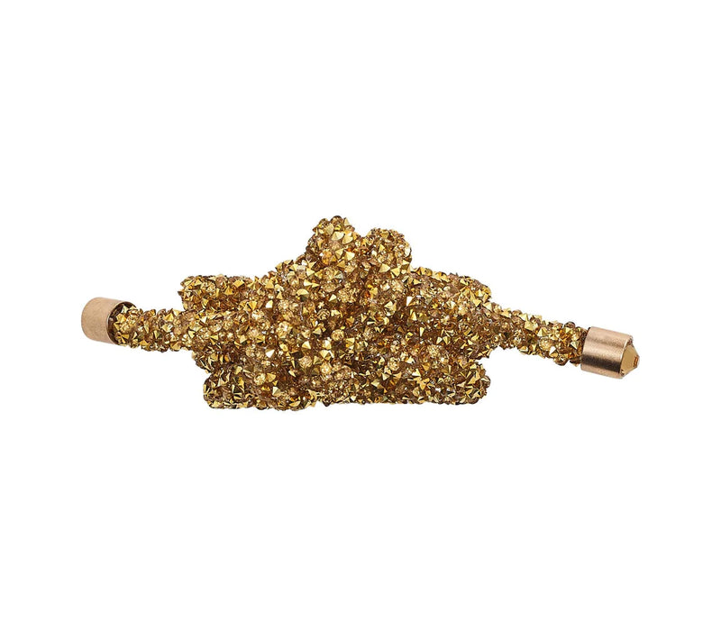 Top view of gold Glam Knot Napkin Ring featuring sculptural knot detail by Kim Seybert