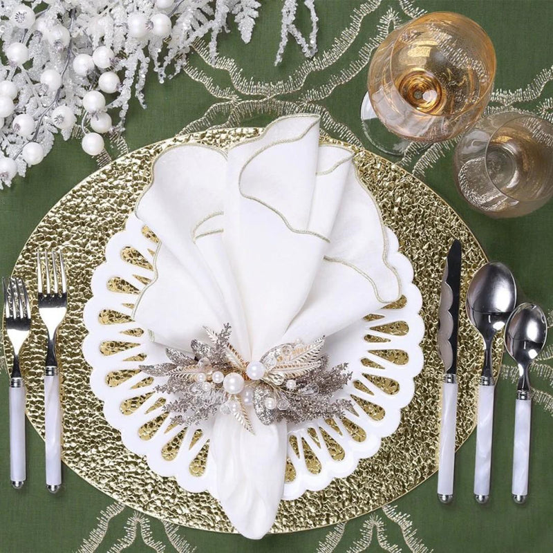 Winter-themed festive table décor with gold accents and Gilded Spray Napkin Ring by Kim Seybert