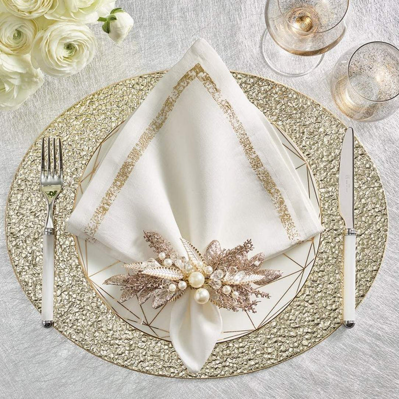 White, cream, and gold holiday table setting featuring Gilded Spray Napkin Ring by Kim Seybert
