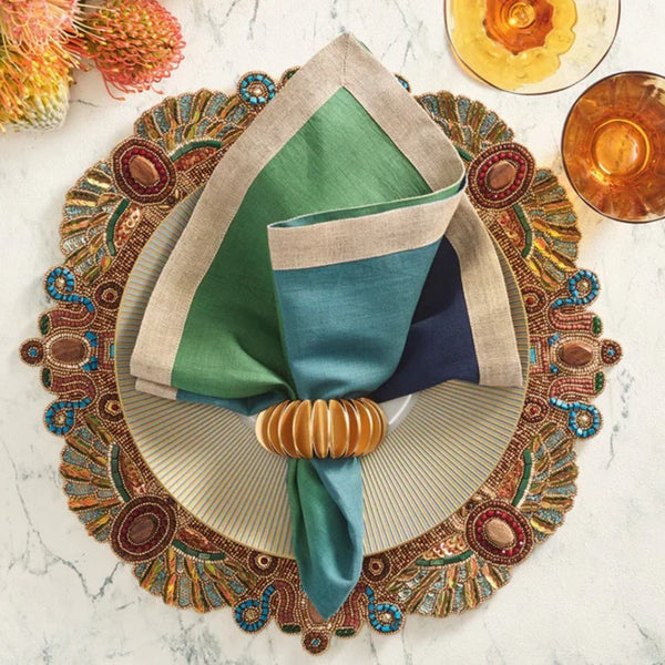 Elegant autumn table setting featuring Demilune Napkin Ring by Kim Seybert in rich seasonal tones