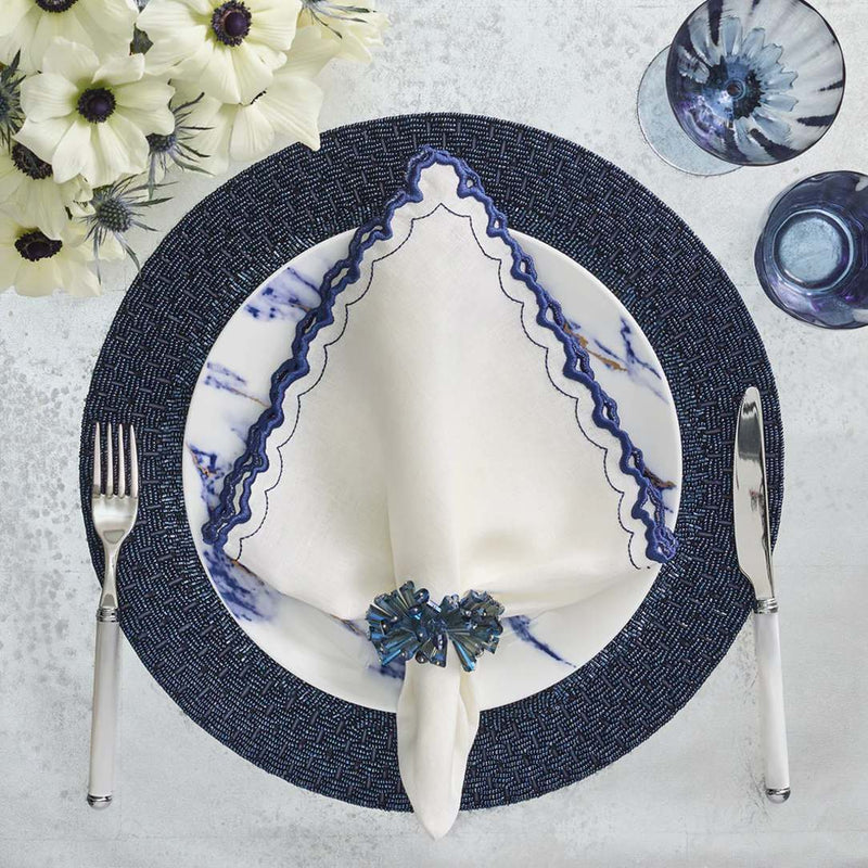 Navy blue and white spring table setting with Dazzle napkin rings, close-up