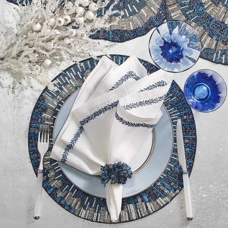 Elegant navy and white dining arrangement featuring Dazzle napkin rings