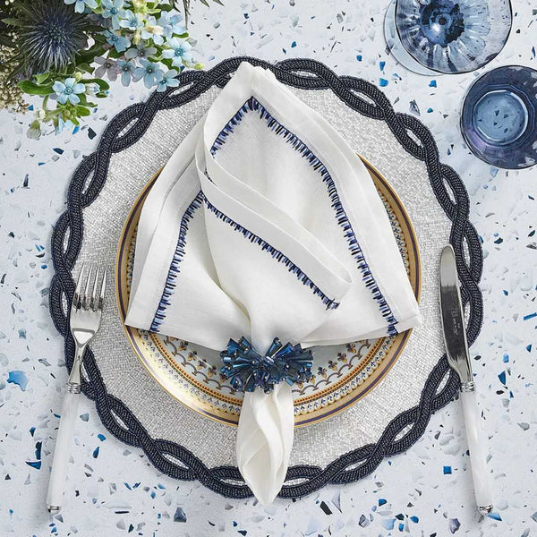 Sophisticated blue and white table décor with Dazzle napkin rings, overhead