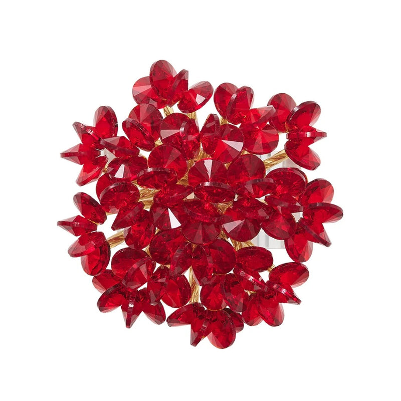 Top view of red Aster Napkin Ring by Kim Seybert with glass and disc-shaped beads