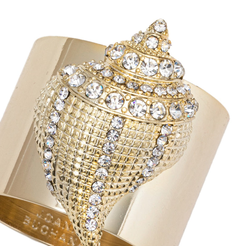Close-up of gold seashell napkin ring adorned with clear crystals by Joanna Buchanan