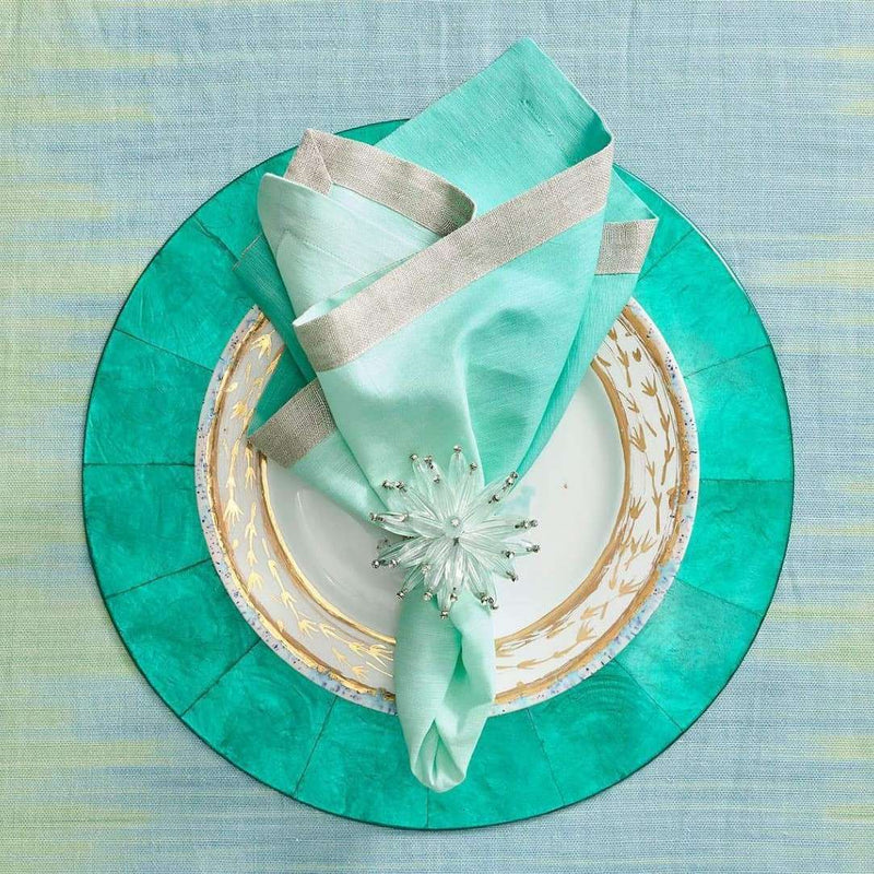 Coastal table setting in turquoise tones featuring seafoam Constellation Napkin Rings by Kim Seybert
