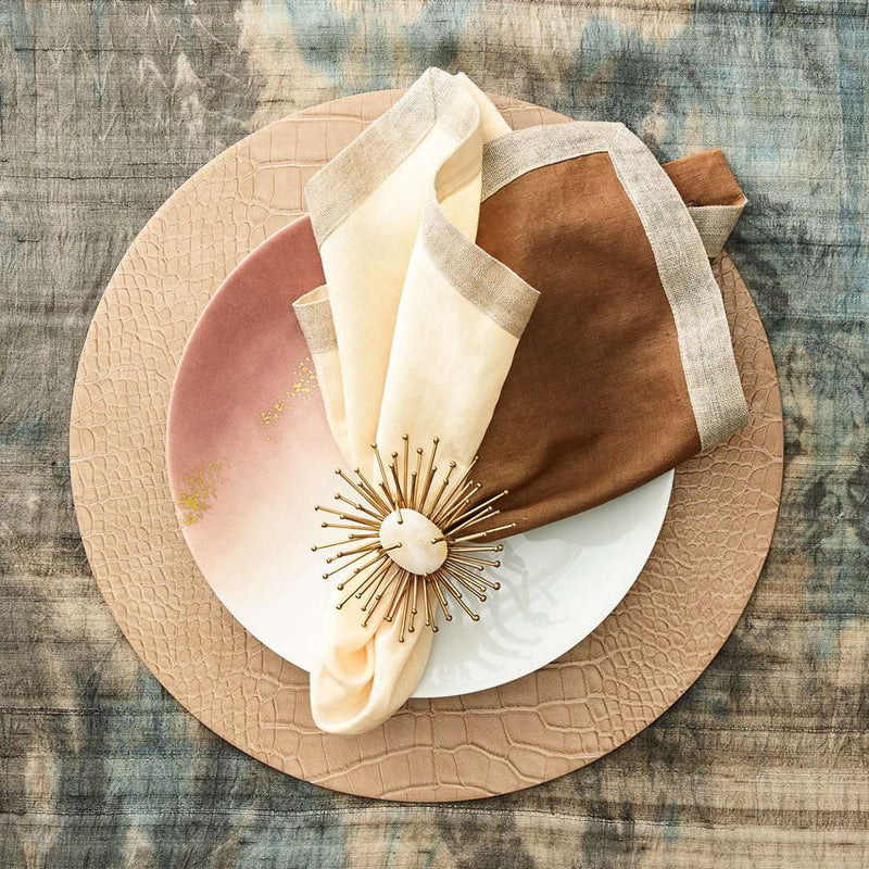 Nude-tone elegant table décor with gold Flare Napkin Ring by Kim Seybert
