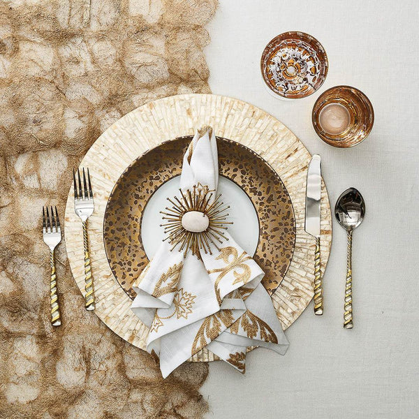 Luxurious white and gold table setting featuring Flare Napkin Ring by Kim Seybert