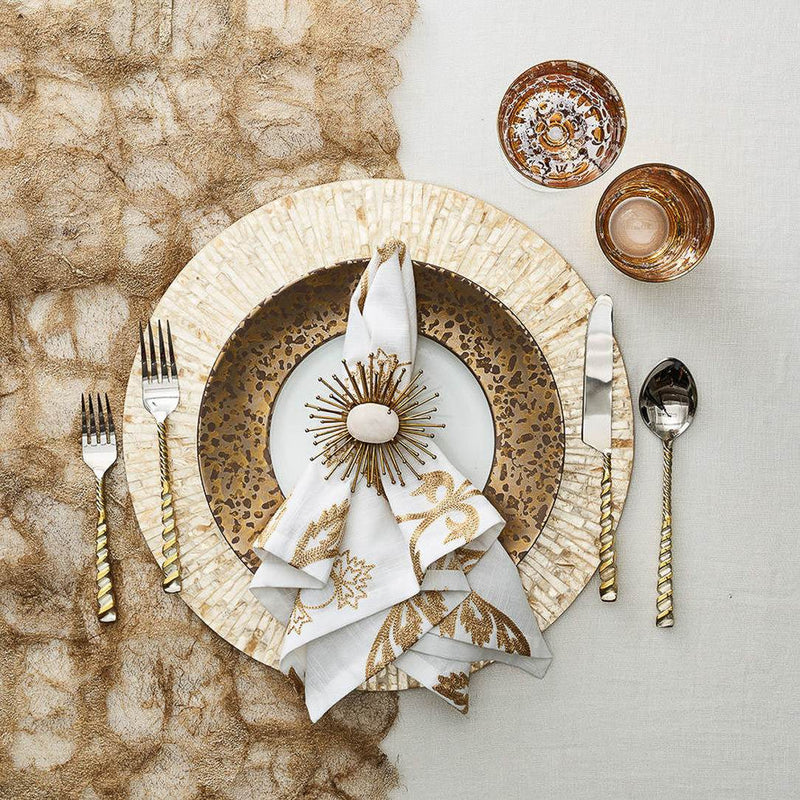 Luxurious white and gold table setting featuring Flare Napkin Ring by Kim Seybert