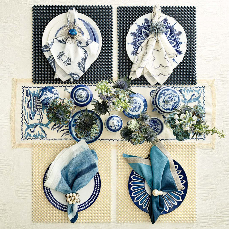 Luxurious tablescape featuring a mix of napkin rings including ivory pearl, available from Amiramour