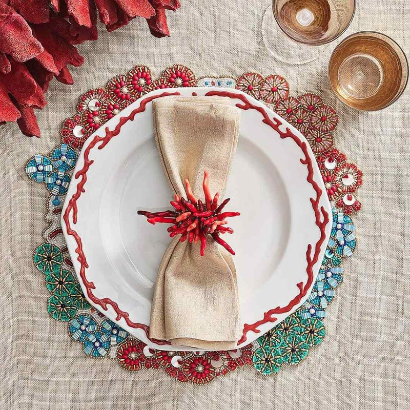 Summer coral-themed table with Kim Seybert Amalfi Napkin Rings in coral, turquoise, and coastal accents