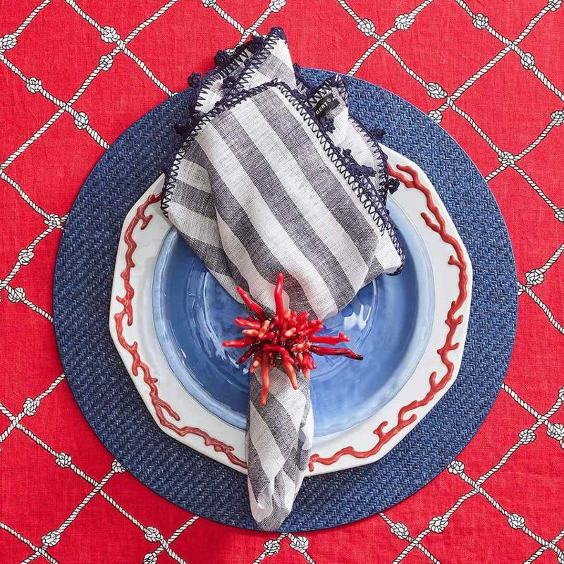 Elegant summer tablescape featuring coral and navy tones with Amalfi Napkin Rings by Kim Seybert