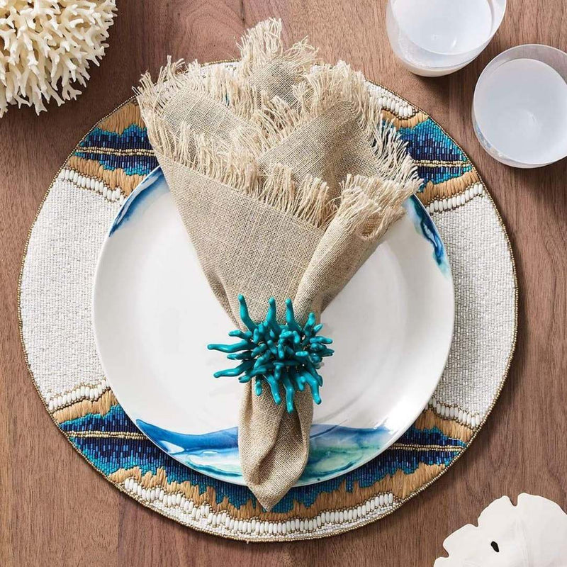 Natural beach-themed table setting with turquoise and beige Amalfi Napkin Rings by Kim Seybert