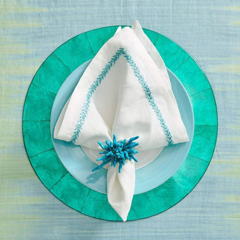 Summer beach tablescape in vibrant turquoise and white, with Amalfi Napkin Rings by Kim Seybert
