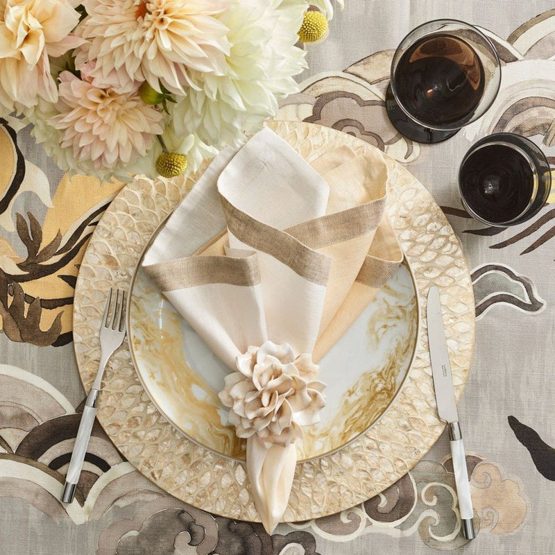 Gold-toned luxury table decoration with ivory Dahlia Napkin Ring by Kim Seybert, available at Amiramour