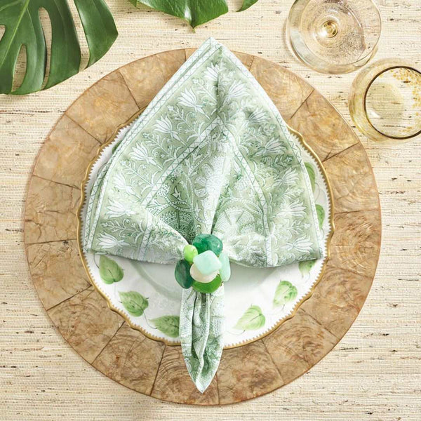 Natural table arrangement with leaf elements and light green and beige accents using Sea Stone Napkin Ring
