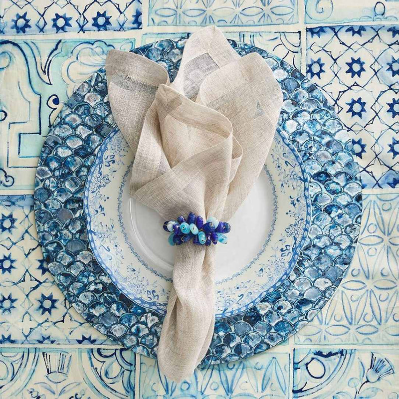 Mediterranean-inspired table setting with blue Poppy Napkin Rings, sea-inspired décor