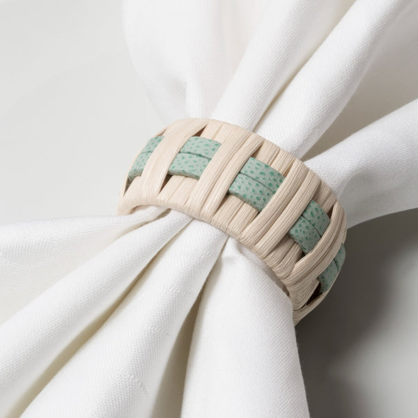 Mint G46 leather and rattan Anglet Napkin Ring on white napkin by Giobagnara x Pigment France