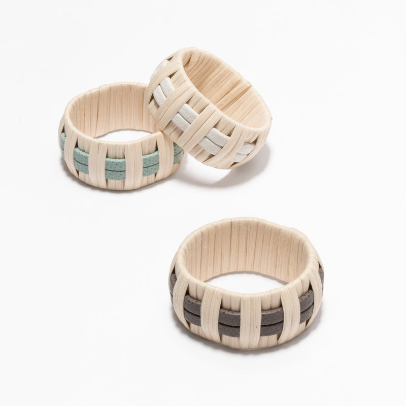 Three Anglet Napkin Rings with rattan and calfskin golf leather in Smoke G24, Mint G46 and Almond G116