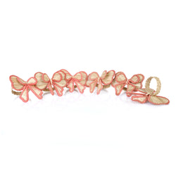 Set of 6 Pink Bows napkin rings by Roseberry Home in salmon-pink tones, sold by Amiramour