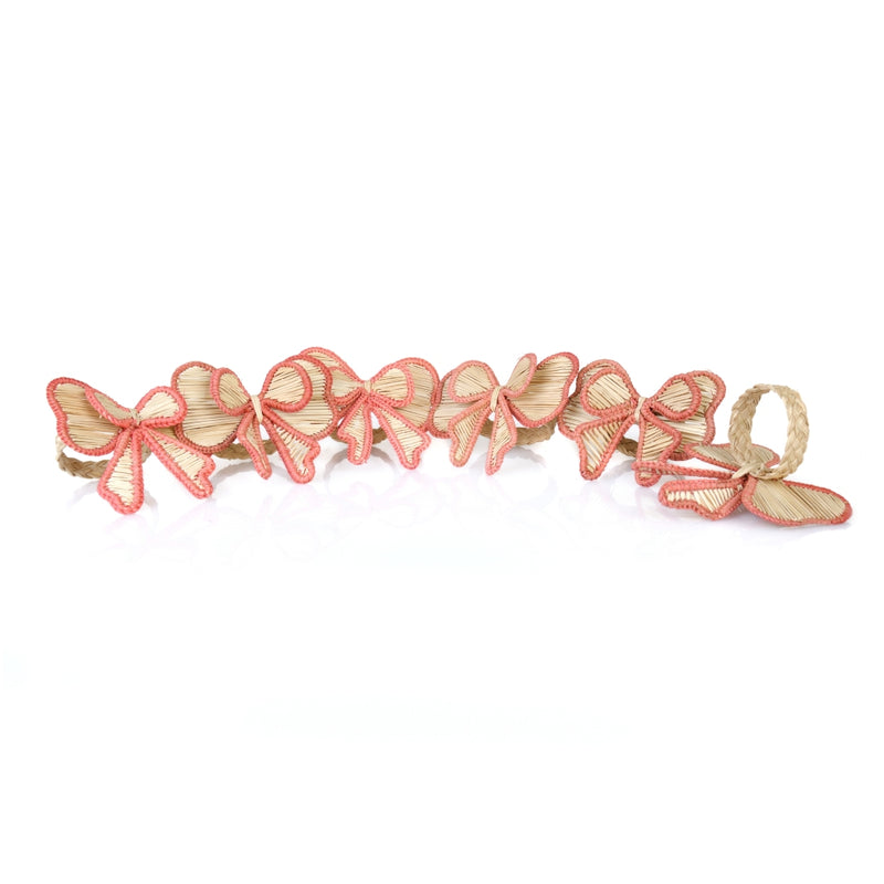 Set of 6 Pink Bows napkin rings by Roseberry Home in salmon-pink tones, sold by Amiramour