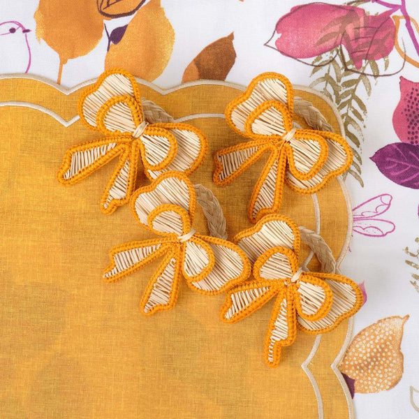 Yellow Bows napkin rings on a yellow placemat by Roseberry Home 