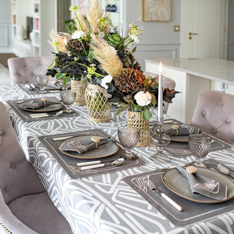 Tablescape of raffia flower napkin ring by Roseberry Home, elegant woven detail