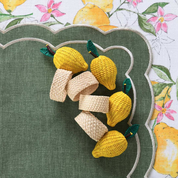Lemon-shaped napkin rings by Roseberry Home styled on a green placemat, creating a fresh and vibrant table look