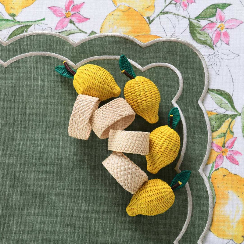 Lemon-shaped napkin rings by Roseberry Home styled on a green placemat, creating a fresh and vibrant table look