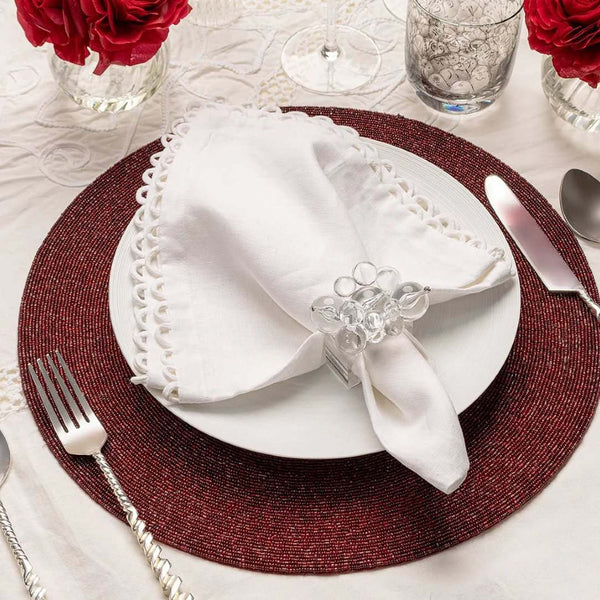 Luxury red placemat with metallic microbeads on modern tablescape.