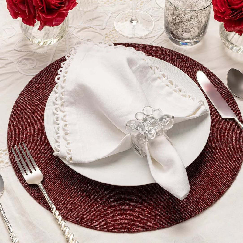 Luxury red placemat with metallic microbeads on modern tablescape.