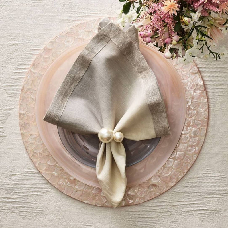 Blush pink Capiz shell placemat with luxury napkin.