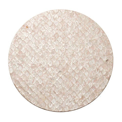 Blush pink Capiz shell placemat with scalloped edges by Kim Seybert.