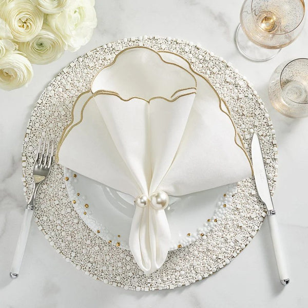 Elegant dining setup with white Bianco round beaded placemat.