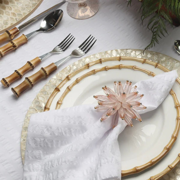Champagne gold round placemat with hand-cut capiz shells by Kim Seybert side view.
