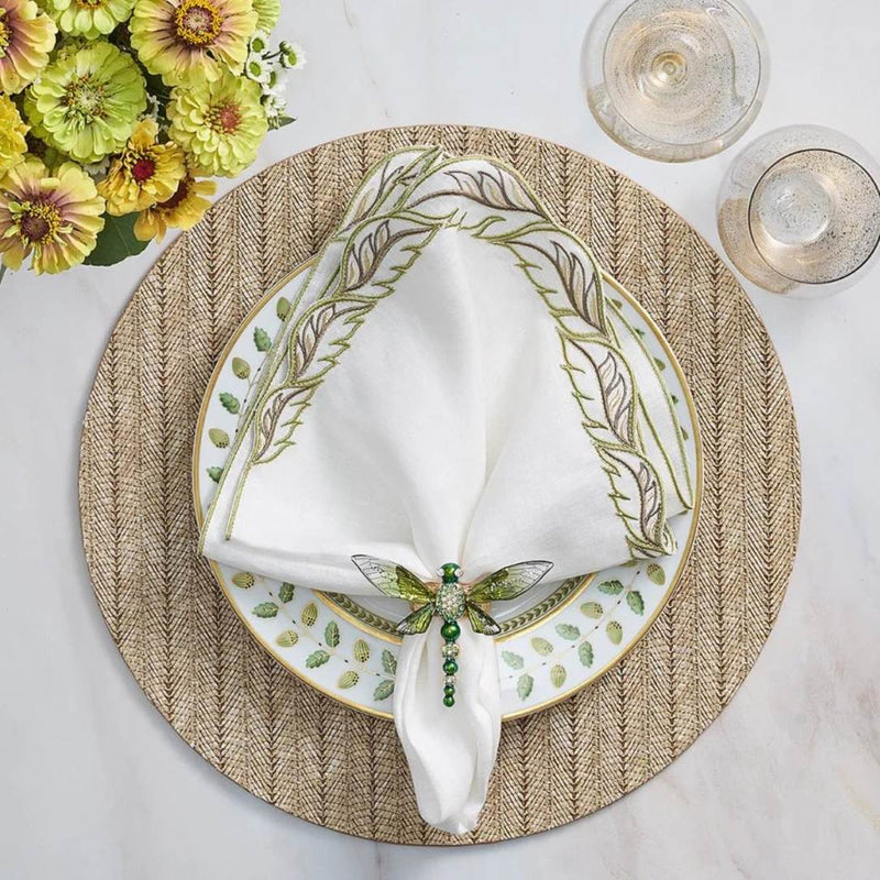 Tan brown herringbone round placemat in woven polyvinyl with dragonfly napkin ring.