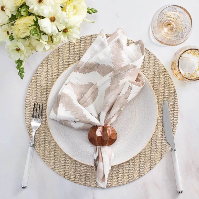Tan brown herringbone round placemat in woven polyvinyl with wood napkin ring.