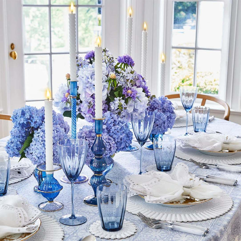 Luxury blue and white table setting with white Lumina beaded placemat.