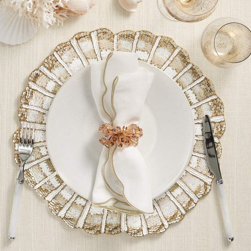 Nautilus placemat in white, gold, and champagne hand-beaded spiral design with sparkle gold napkin ring.