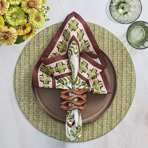 Moss green Chevron placemat with textured stitching with wood napkin ring.